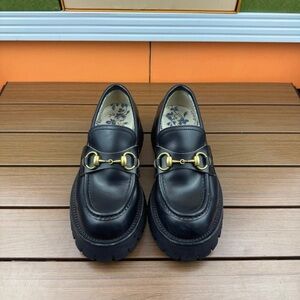 Gucci Black Loafers with Gold Detailing